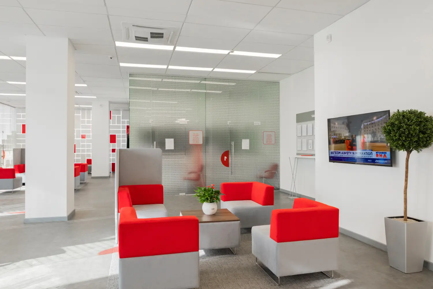 High-end modern architectural open-plan executive office with linear timber slatted ceiling and glazed partitioned meeting suites